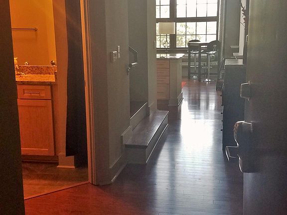 View from front door. Bathroom is to the left. Downstairs bedroom/office also to the left.