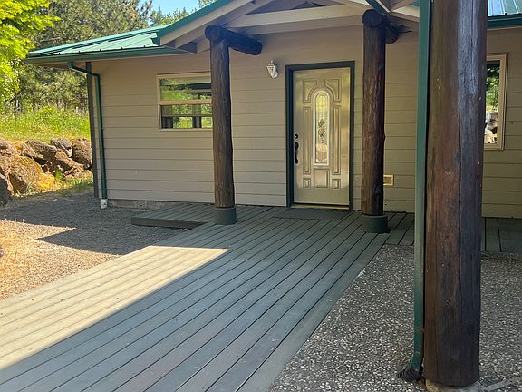 This is the front door. I was not able to download a photo of the living room with the many windows inside.