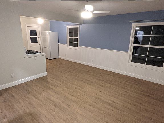 Living Space - includes ceiling fan, mini-split A/C and heat, beautiful wainscotting, hard floors, easy-open windows.