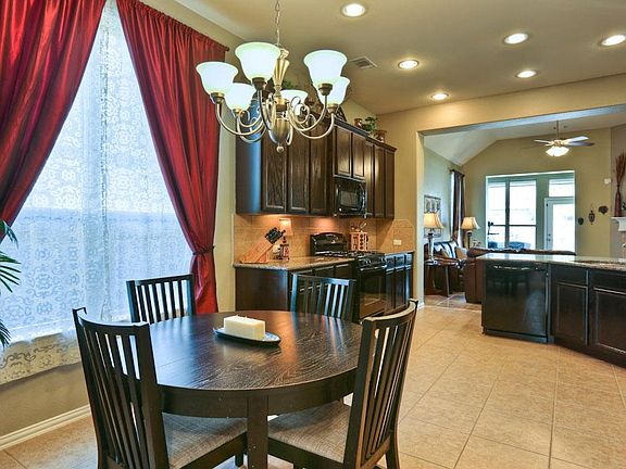Custom drapes add to the richness of the breakfast room.