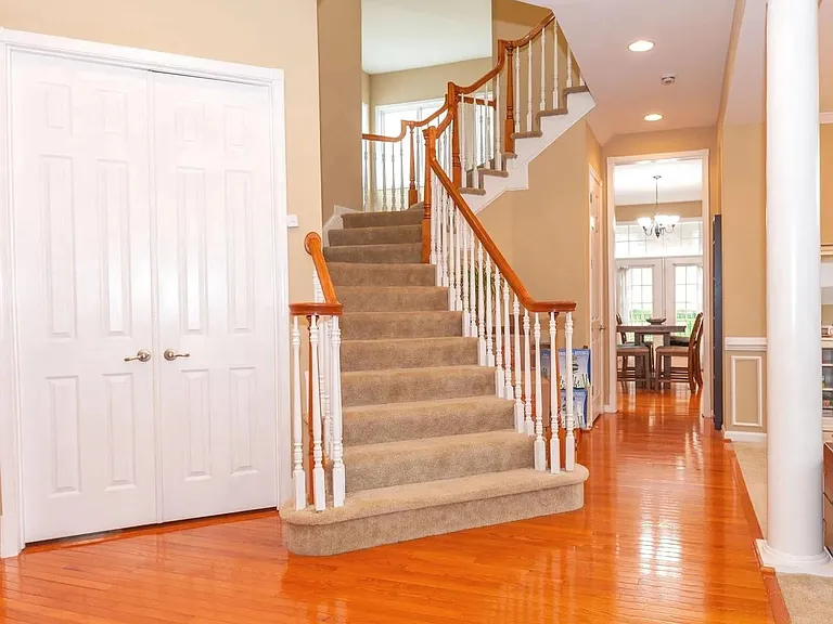 Grand Entrance, staircase, French doors to office/study. 10' Ceiling height