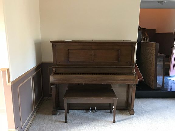 living room with Piano for the musician in the family