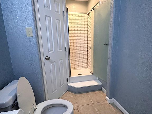 Master bathroom with shower and closet