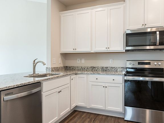 Granite countertops and white cabinetry