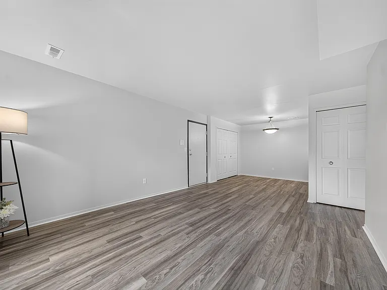 Spacious living and dining room at Woodland Villa Apartments in Westland, MI.