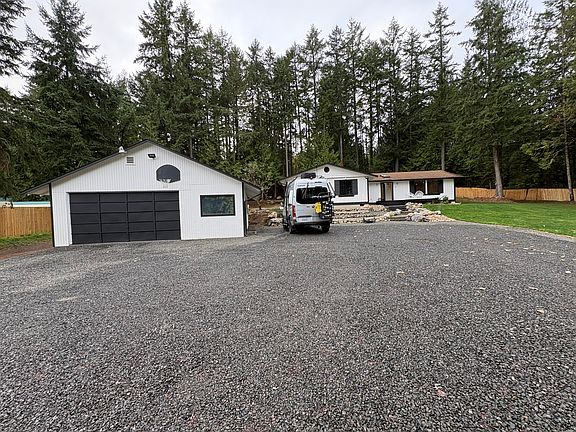 Front of house with spacious parking