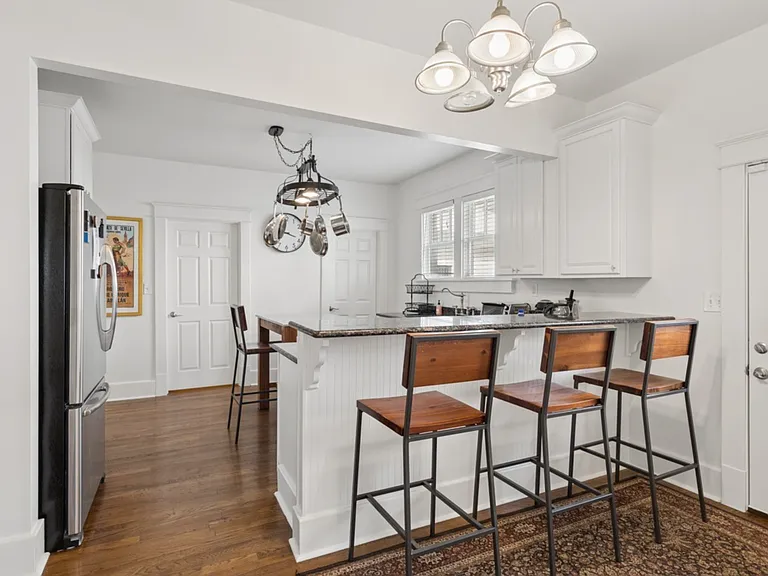 Whether preparing for a busy day or unwinding over a shared meal, this inviting kitchen brings people together with warmth, functionality, and timeless style.