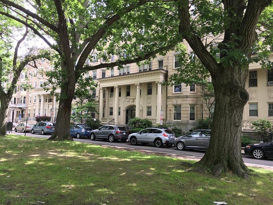 Building entrance, across the street from beautiful park and
