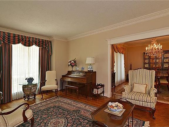 To the left of the entry is a second living area.  What a great place for a music room or a reading nook!  Recent warm paint and wood floors add to the cozy feel.