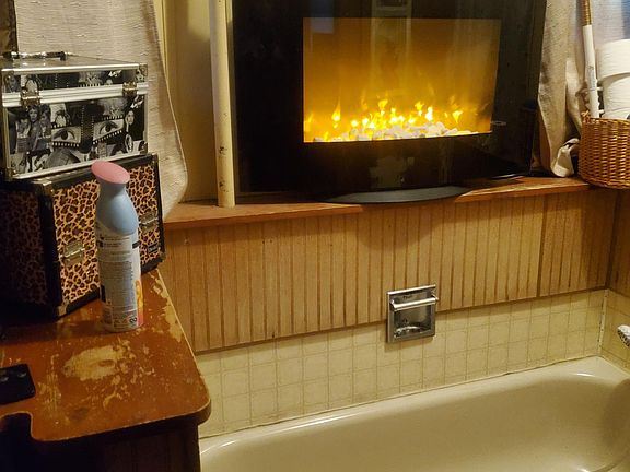 Large bathroom with separate tub and shower stall.