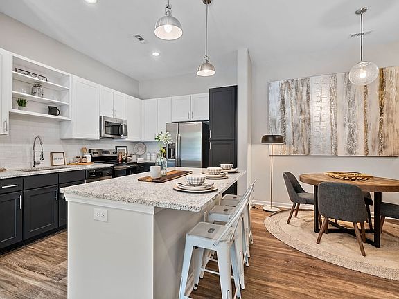 Kitchen and dining area with hard surface flooring