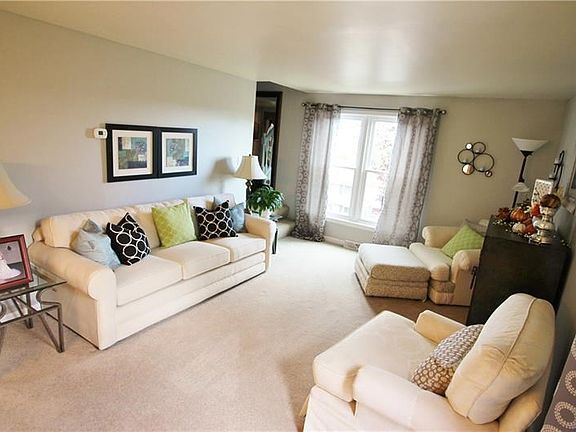 This elegant living room dressed in soft soothing tones creates a special place to entertain your guests.