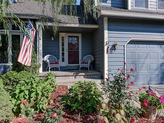 LOVELY LANDSCAPED AREA AND FRONT PORCH GREET YOU AND YOUR GUEST