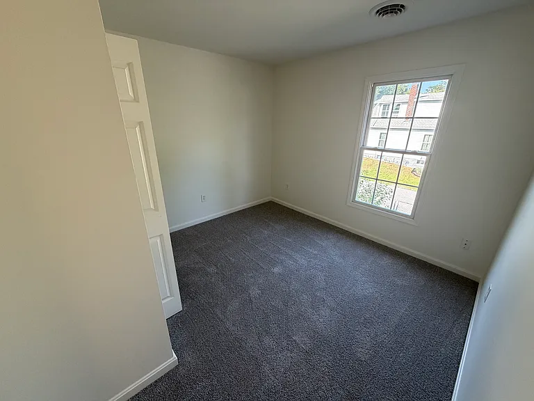 3rd Bedroom with new carpet and large window