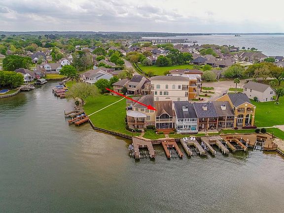 Another aerial view of the patio, deck and boat slips. Easy in and out!