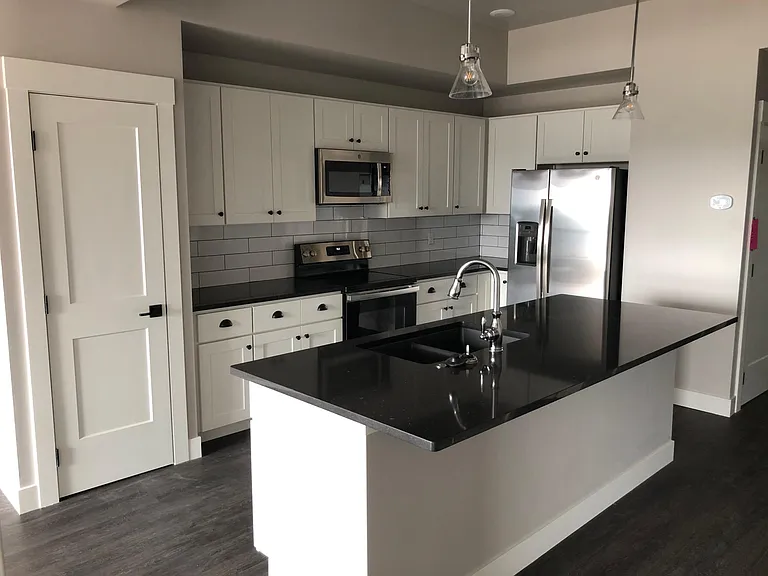 Large kitchen with massive island and bar seating. Lots of cabinet space and a separate pantry