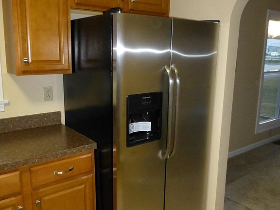 Stainless steel refrigerator with ice and water in door