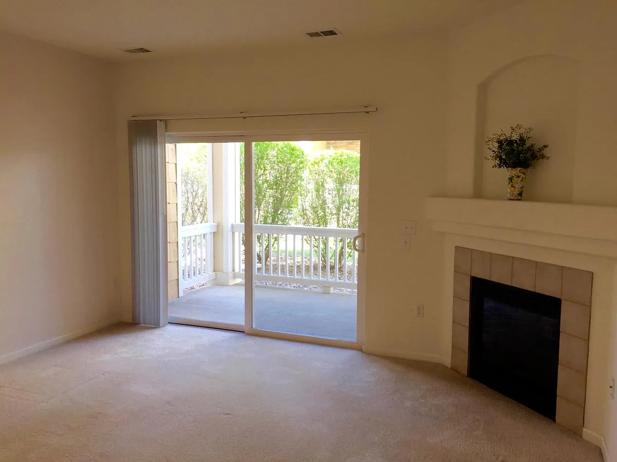 The living room has a cozy gas fireplace and a large outdoor patio - Boulder Cir