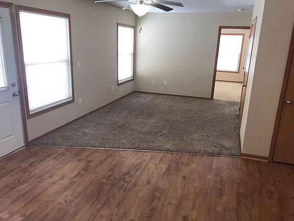 Living room is open to rest of unit, great flow through