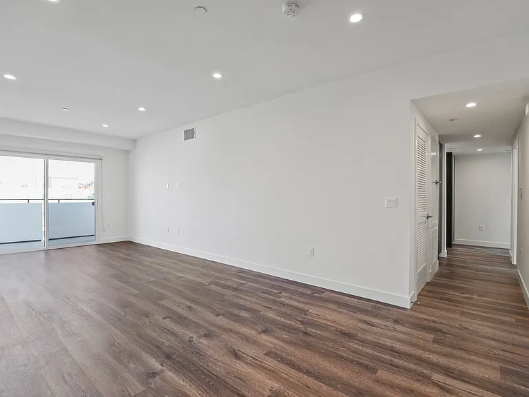 Large-Size Living Room with Recessed Lighting, Vinyl Flooring, and Patio