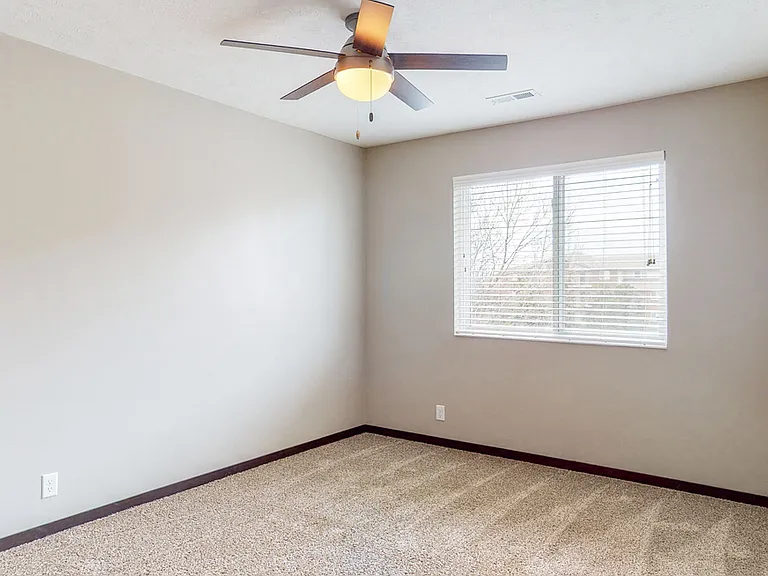This renovated Maple bedroom offers plenty of space and natural llight.