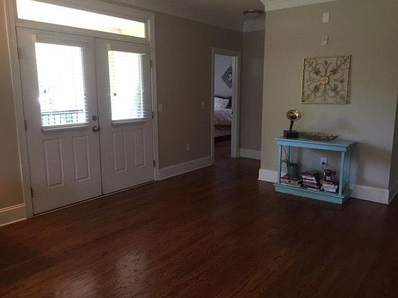 Dining area opens to balcony and park views.