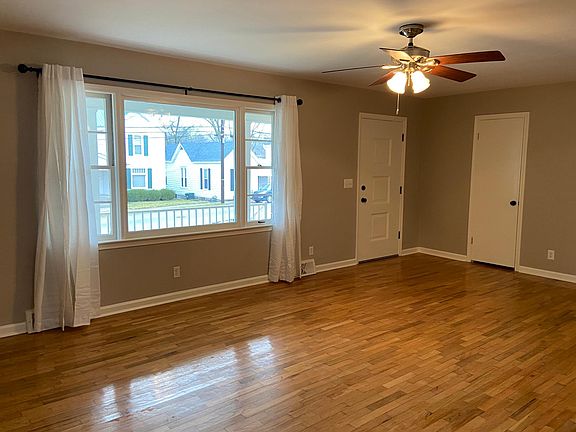 Living room, showing front door and coat closet.