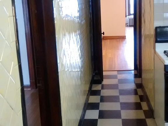 Kitchen hallway to dining room and living room, second bedro