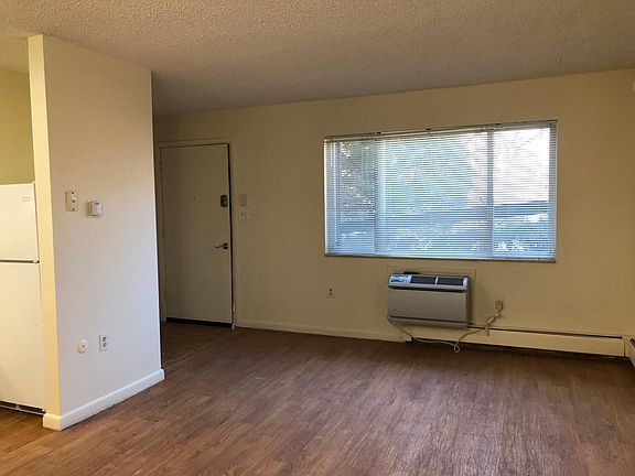 Living Room with Air Conditioner and front door electronic lock (no keys)