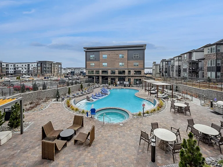 Resort-Style Pool with Sun Shelf and Grilling