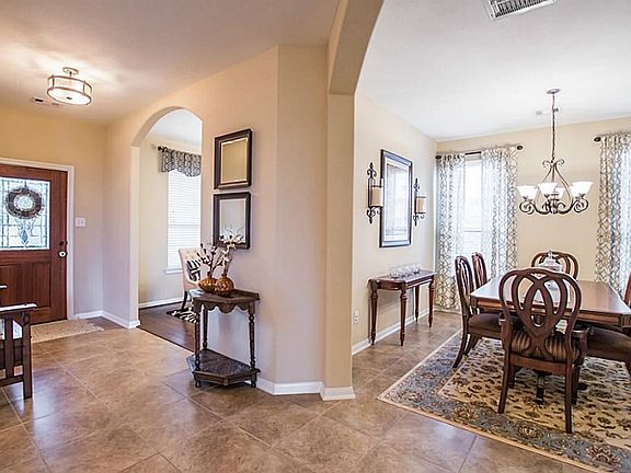 Elegant entryway with the study and formal dining room.
