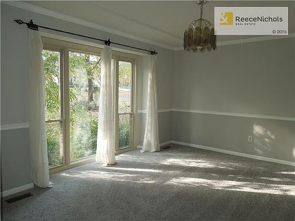 Large formal dining room with lots of light.