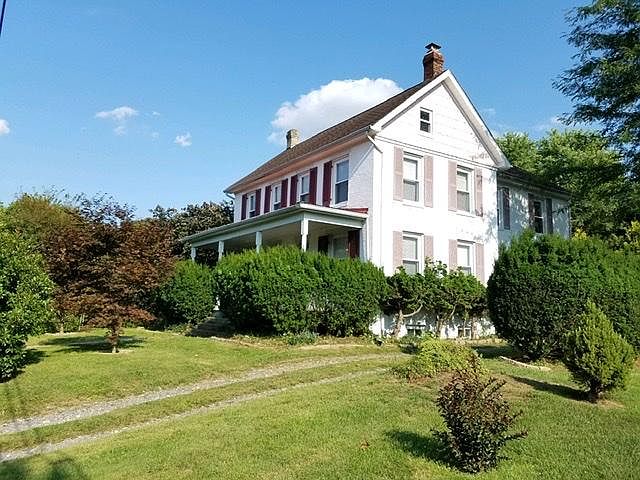 Beautiful Victorian home is fully renovated and has a covered front porch, large back deck and a huge back yard. The yard is beautifully landscaped with sitting gardens, ornamental trees and shrubs and 100s of flowers blooming. Relax in the privacy of nat