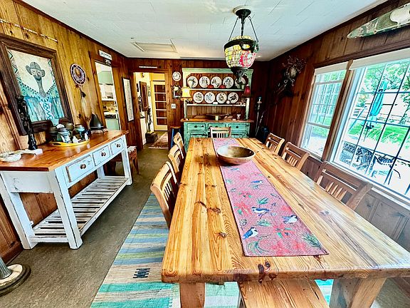 Expansive recycled pine dining room table and chairs imported from Western Australia.