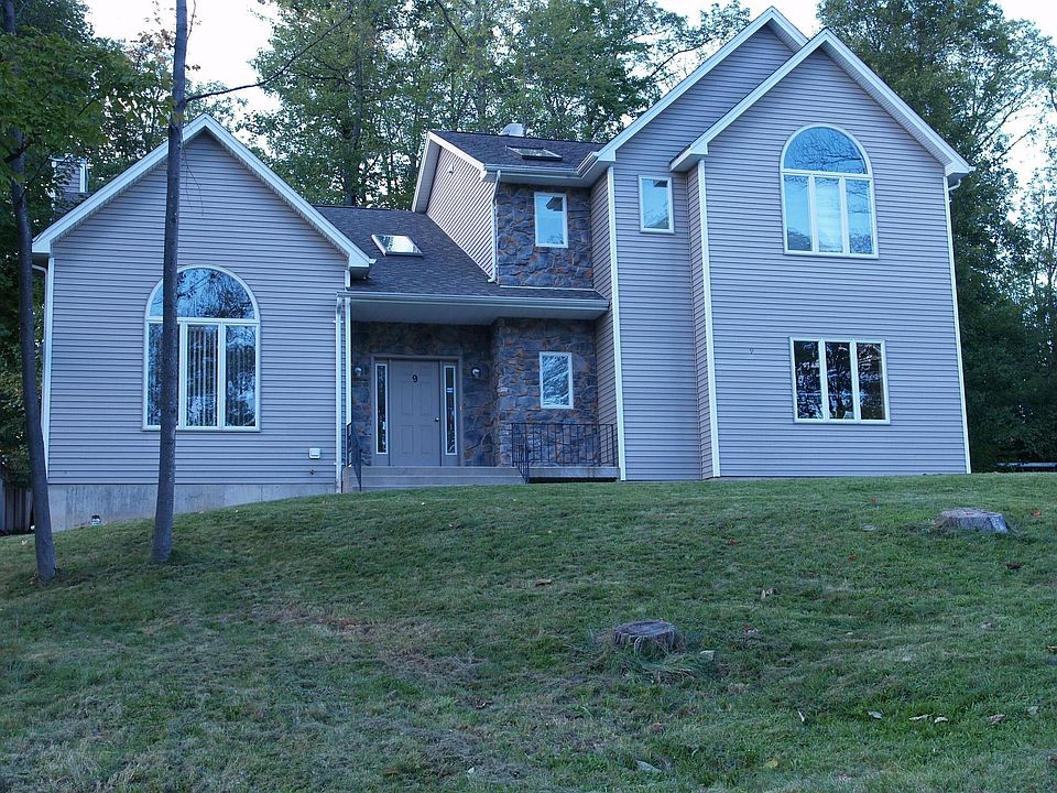 Front with stone and vinyl exterior