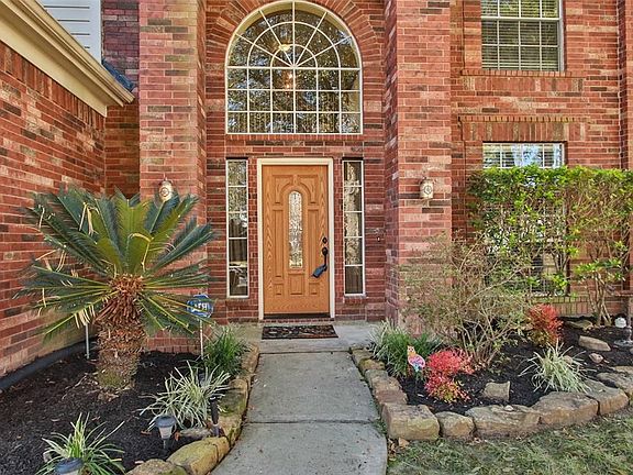 Beautifully landscaped Two-Story brick home with 4 bedrooms, Formal Dining & Gameroom.