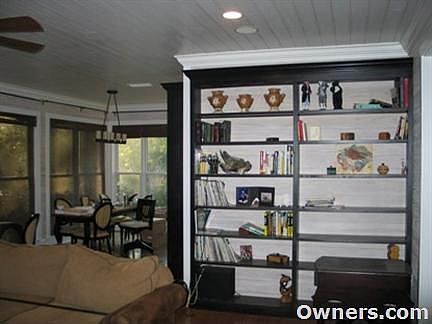 Sunroom w/ built-in bookshelves