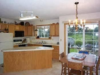 Kitchen & dining area overing looking patio