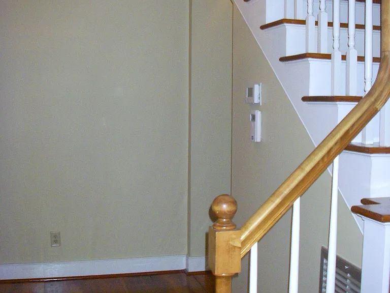 Stairwell to upstairs. Lots of storage space in this hallway.