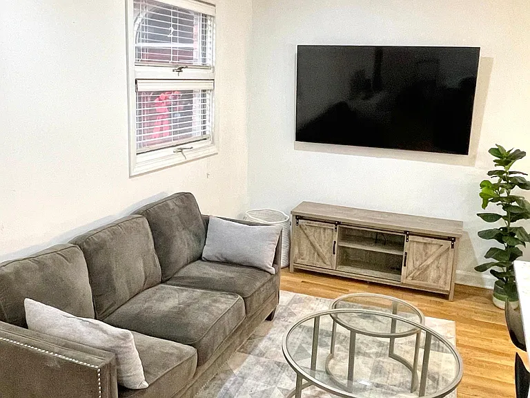 Living room. The wall fits an 80"+ TV
