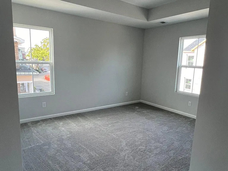 Spacious master bedroom (#4) with large windows
