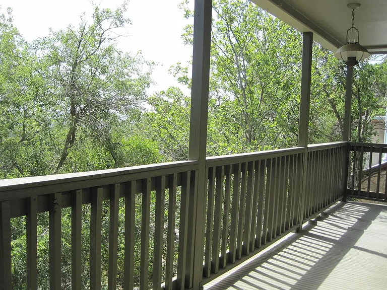 Balcony, runs full length of 2nd floor with access by 2 sliding doors at each end