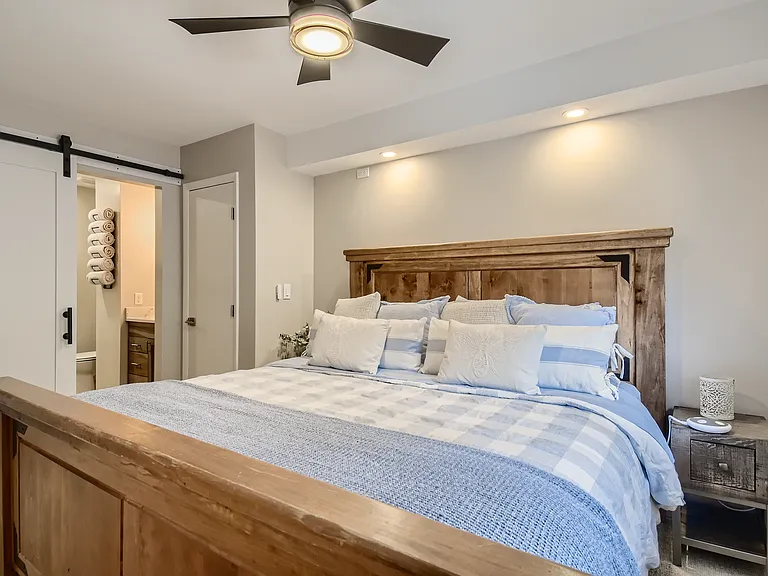 master bedroom with en suite bathroom and king sized bed