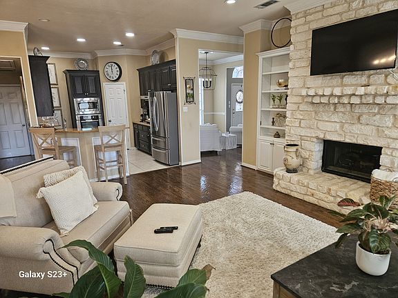 Family Room/Kitchen with included mounted TV.