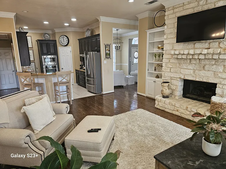 Family Room/Kitchen with included mounted TV.