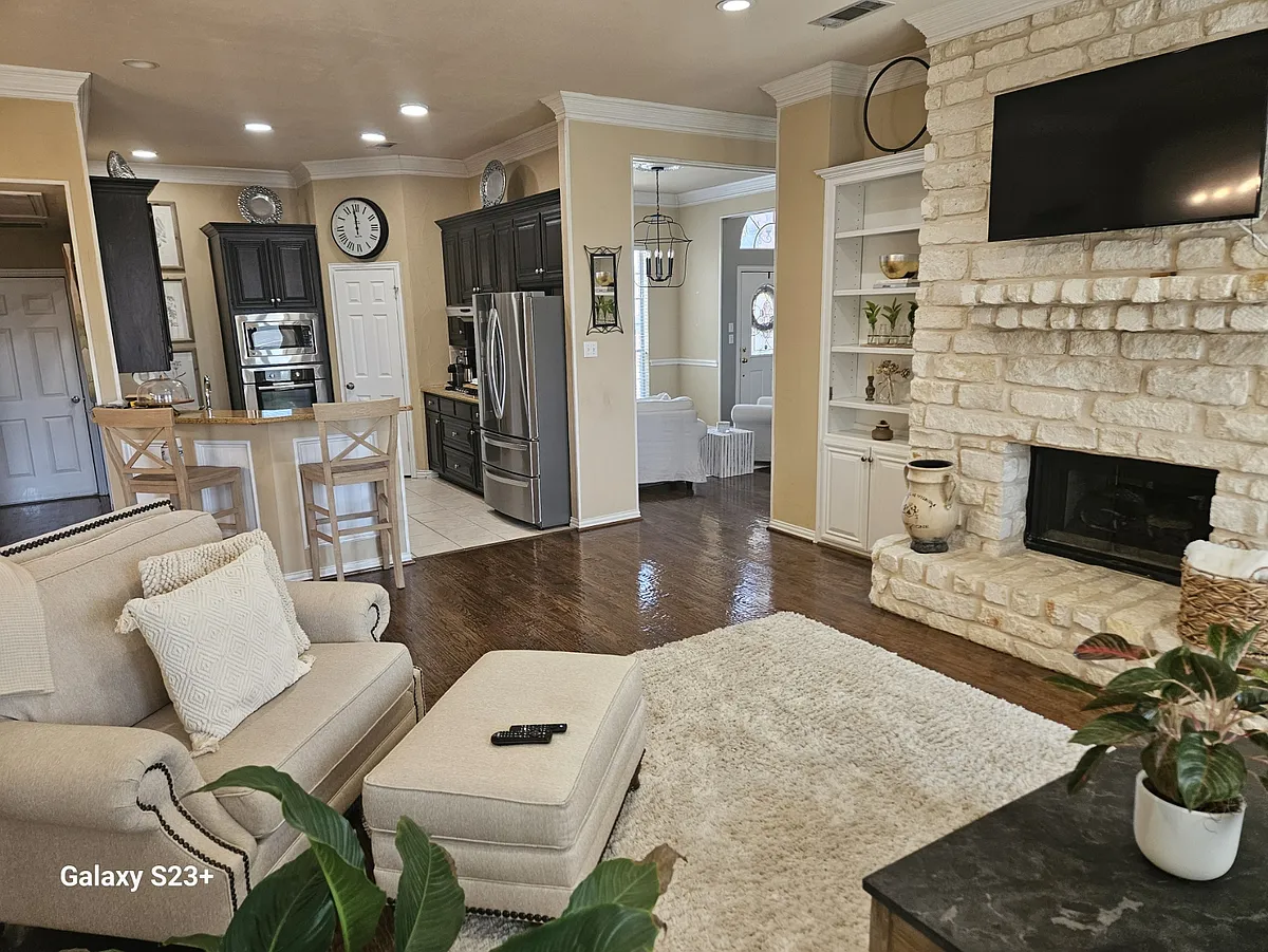 Family Room/Kitchen with included mounted TV. - Blue Quail Rd