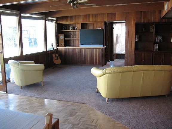 Bonus room with lots of window out to large yard with pool