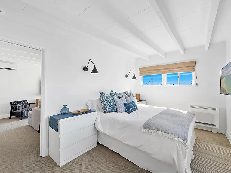 Comfortable bedroom, dressers on either side of the bed, plus closet for storage