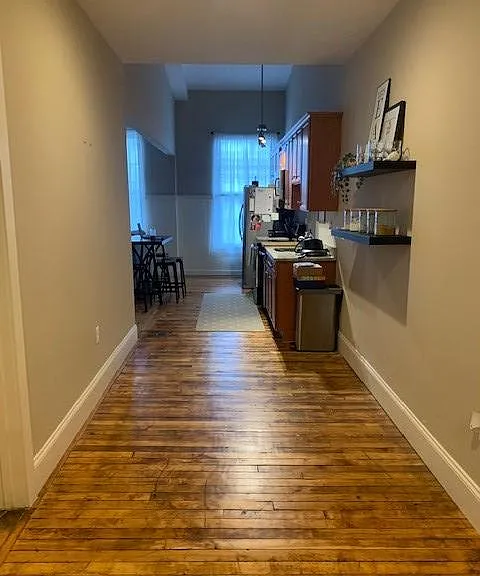 entrance looking towards kitchen/living area, bathroom and second bedroom on the left