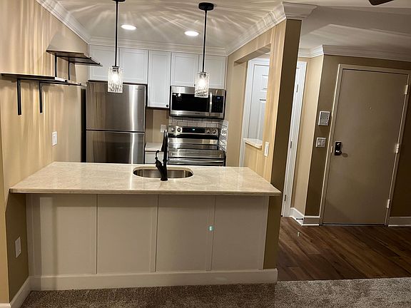 Breakfast bar countertop. Entryway to the right.